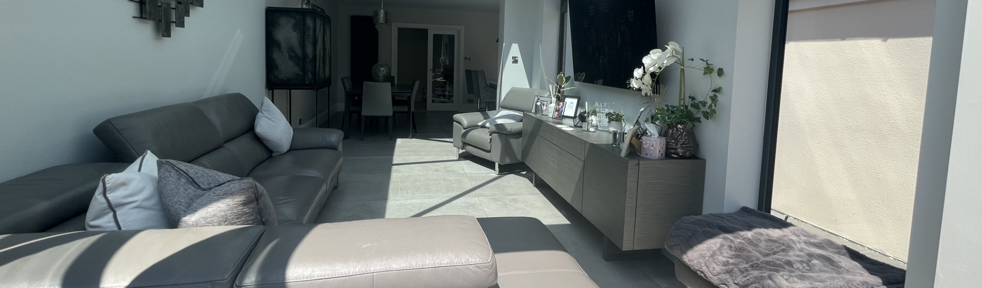 a living room with a couch and a table